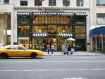 A yellow cab picks a client at Sephora shop